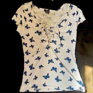 It has butterflies on it and a xs